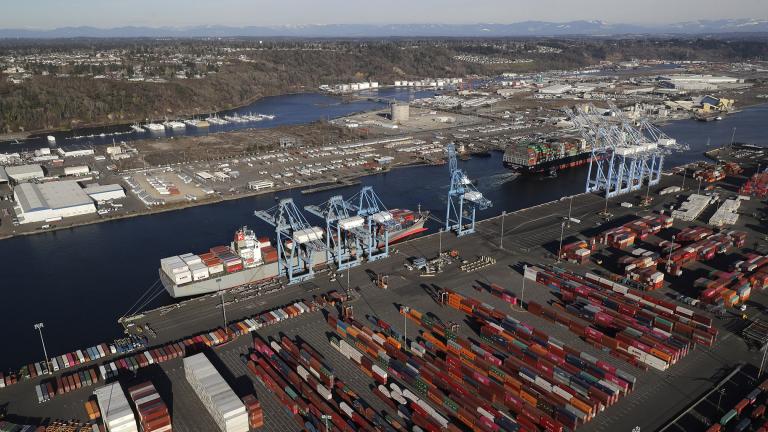 In this March 5, 2019, file photo, cargo containers are staged near cranes at the Port of Tacoma, in Tacoma, Washington. (AP Photo / Ted S. Warren, File)