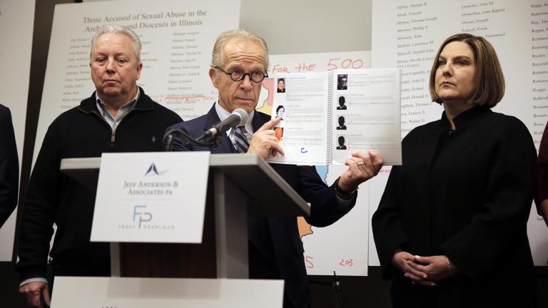 Attorney Jeff Anderson speaks as Joe Iacono, left, and Cindy Yesko listen during a news conference in Chicago on Wednesday, March 20, 2019. Advocates for clergy abuse victims say their list of 395 priests or lay people in Illinois who have been publicly accused of sexually abusing children is far more extensive than the names already released by the state’s six dioceses. (AP Photo / Kiichiro Sato)