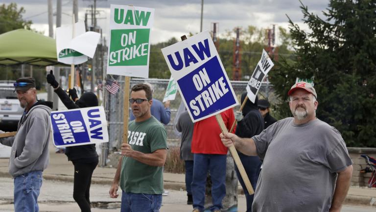 John Kirk, right, a 20-year-employee, pickets with co-workers outside the General Motors Fabrication Division, Friday, Oct. 4, 2019, in Parma, Ohio. (AP Photo / Tony Dejak)
