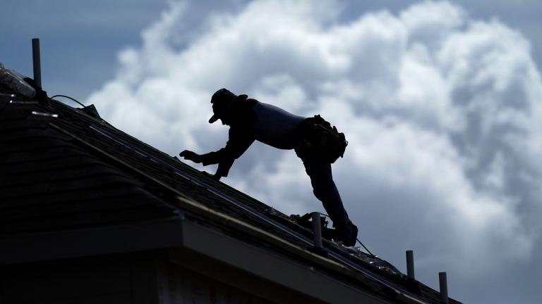 A roofer works on a new home under construction Thursday, July 18, 2019, in Houston. A heat wave is expected to send temperatures soaring close to 100 degrees through the weekend across much of the country. (AP Photo / David J. Phillip)