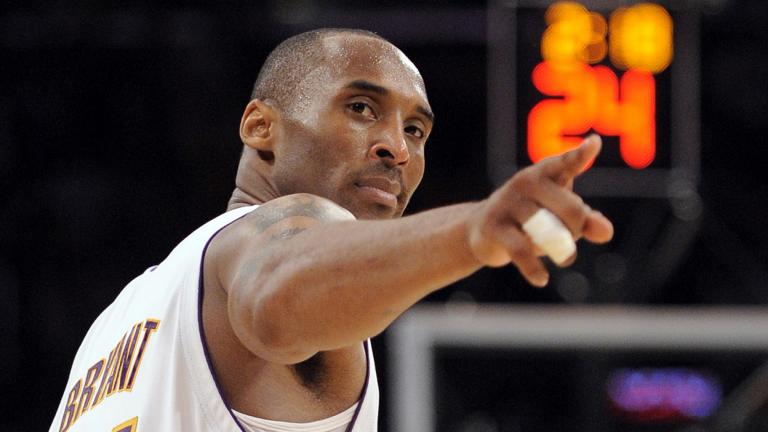 In this June 7, 2009, file photo, Los Angeles Lakers guard Kobe Bryant (24) points to a player behind him after making a basket in the closing seconds against the Orlando Magic in Game 2 of the NBA basketball finals, in Los Angeles. (AP Photo / Mark J. Terrill, File)