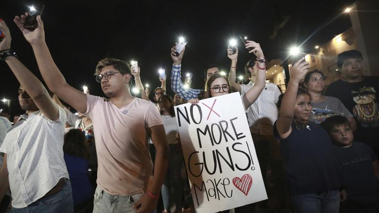 People gather in Juarez, Mexico, on Saturday, Aug. 3, 2019, in a vigil for the three Mexican nationals who were killed in an El Paso shopping-complex shooting. (AP Photo / Christian Chavez)