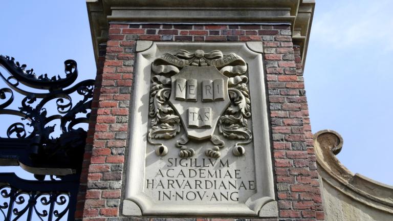 A relief sculpture rests on a gate to the entrance of Harvard University, in Cambridge, Mass., March 13, 2016. (AP Photo / Steven Senne, File)