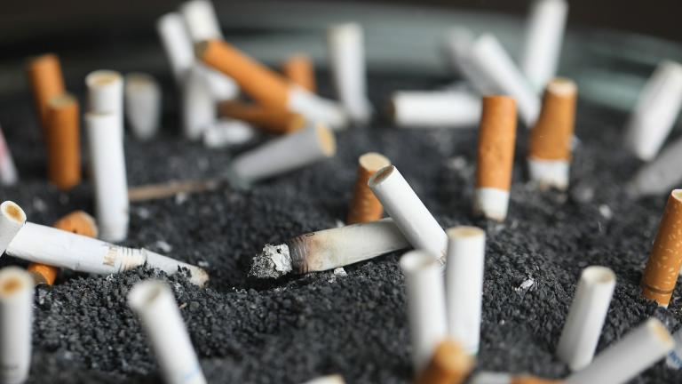 This March 28, 2019 photo shows cigarette butts in an ashtray in New York. On Wednesday, Jan. 8, 2020, researchers reported the largest-ever decline in the U.S. cancer death rate, and they are crediting advances in the treatment of lung tumors. (AP Photo / Jenny Kane, File)