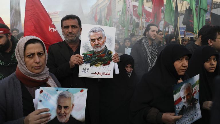 Mourners holding posters of Iranian Gen. Qassem Soleimani attend a funeral ceremony for him and his comrades, who were killed in Iraq in a U.S. drone strike on Friday, at the Enqelab-e-Eslami (Islamic Revolution) Square in Tehran, Iran, Monday, Jan. 6, 2020. (AP Photo / Ebrahim Noroozi)