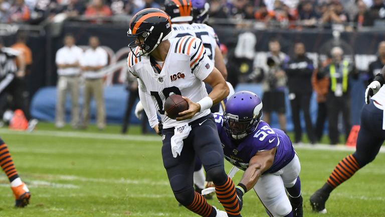Chicago Bears quarterback Mitchell Trubisky (10) scrambles away from Minnesota Vikings outside linebacker Anthony Barr (55) during the half of an NFL football game Sunday, Sept. 29, 2019, in Chicago. (AP Photo / Matt Marton)