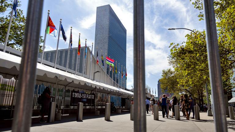 Seen through the bars of a temporary security barrier, people walk along 1st Avenue in New York in front of United Nations Headquarters as the United Nations General Assembly gets underway Saturday, Sept. 21, 2019 and into the coming week. (AP Photo / Craig Ruttle)