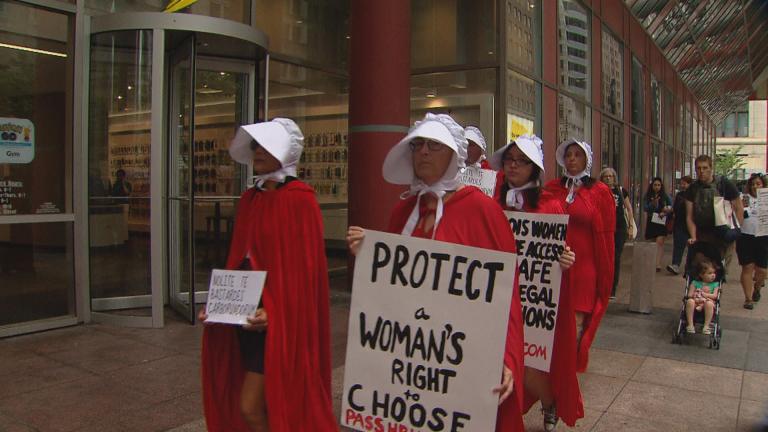 Women march past the Thompson Center in Chicago as part of an abortion rights demonstration in May 2019. (WTTW News)