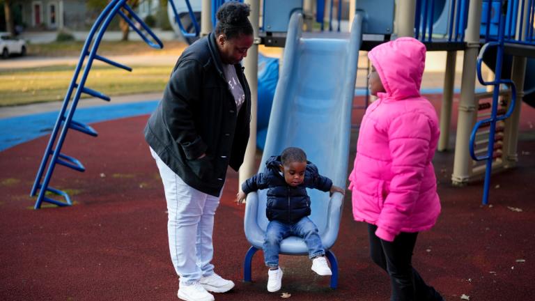 Anika Chillis spends time with her children, Makhi 2, and Myla 9, at a playground Monday, Dec. 2, 2024, in Memphis, Tenn. (AP Photo / George Walker IV)