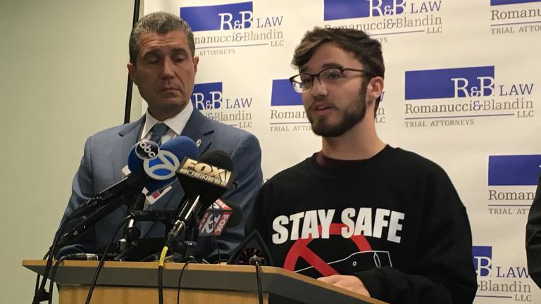 Gurnee resident Adam Hergenreder, 18, right, talks about how he began using e-cigarettes at a Friday, Sept. 13 press conference alongside his attorney Antonio Romanucci. (Kristen Thometz / WTTW News)
