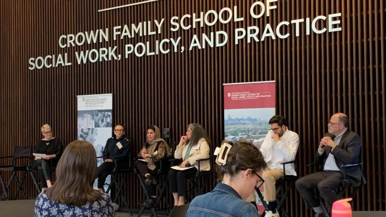 Sima Quraishi, executive director of Muslim Women’s Resource Center, third from left, speaks about her experience assisting Afghan evacuees during a discussion held at the University of Chicago’s Crown Family School of Social Work, Policy, and Practice on April 17, 2024. (Eunice Alpasan / WTTW News)
