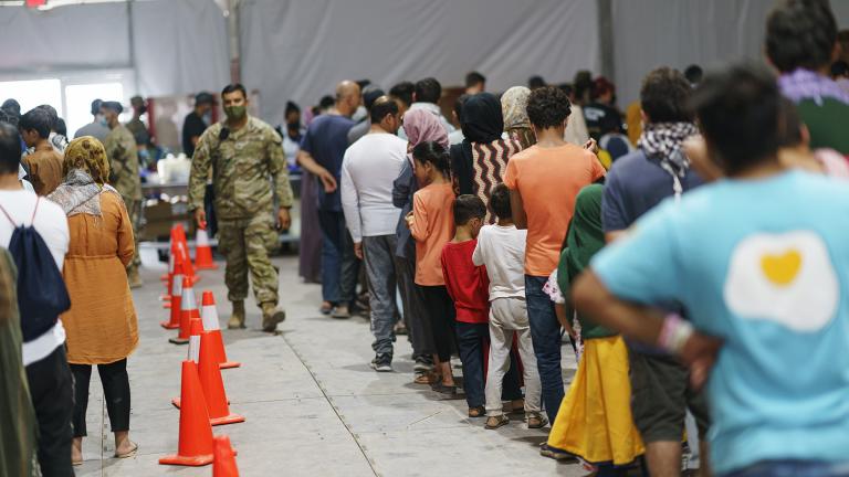  Afghan refugees line up for food in a dining hall at Fort Bliss’ Doña Ana Village, in New Mexico, where they are being housed, Friday, Sept. 10, 2021. (AP Photo / David Goldman)