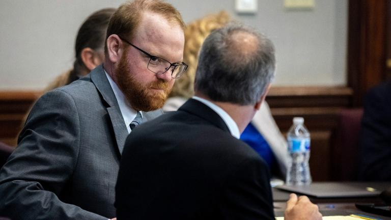Defendant Travis McMichael speaks with his attorney Bob Rubin while they wait for the jury to return to the courtroom during the trial of McMichel and his father, Greg McMichael, and a neighbor, William "Roddie" Bryan in the Glynn County Courthouse, Wednesday, Nov. 24, 2021, in Brunswick, Ga. (AP Photo / Stephen B. Morton, Pool)