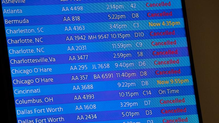 The arrivals board at the American Airlines terminal at LaGuardia Airport displays the flights that have been canceled or delayed and one that is on time, March 21, 2020, in New York. (AP Photo / Mary Altaffer, File)