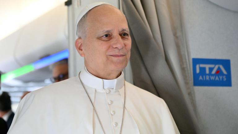 Pope Leo XIV speaks to journalists aboard his flight bound for Algiers’ Houari Boumédiène International Airport on Monday, April 13, 2026, at the start of an 11-day apostolic journey to Africa. (Alberto Pizzoli / Pool Photo via AP)