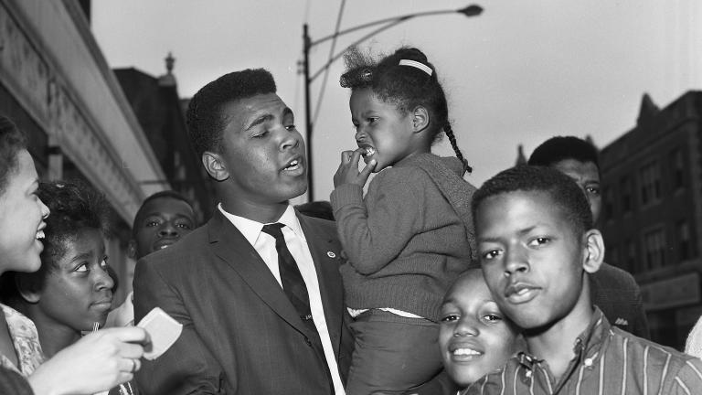 Ali loved a crowd, and often found one on 79th Street in Chicago, near the offices of Muhammad Speaks and the popular Tiger Lounge. (© Lowell K. Riley)  