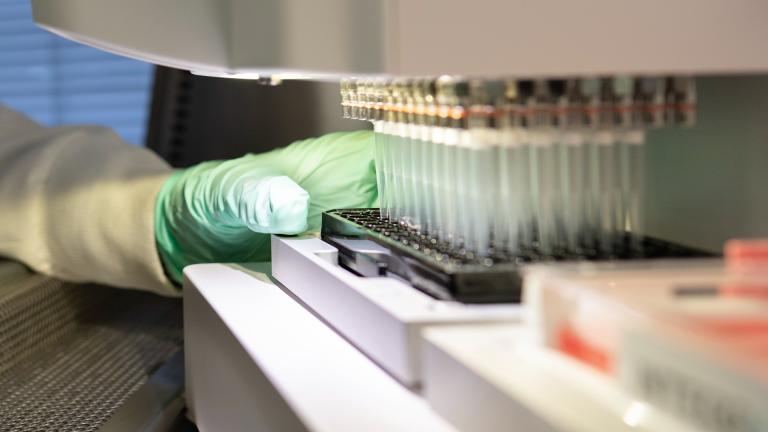 In this 2019 photo provided by Biogen, a researcher works on the development of the medication aducanumab in Cambridge, Mass. (Biogen via AP)