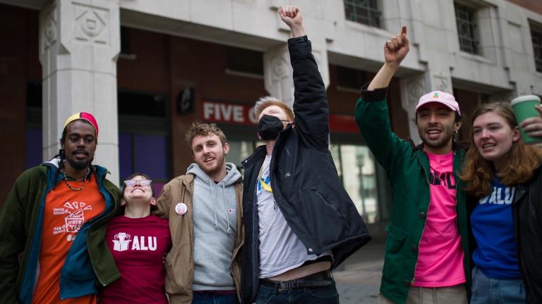 Amazon Labor Union (ALU) members celebrates after an update during the voting results to unionize Amazon warehouse on Staten Island, N.Y., Friday, April 1, 2022, in Brooklyn borough of New York. (AP Photo/Eduardo Munoz Alvarez)