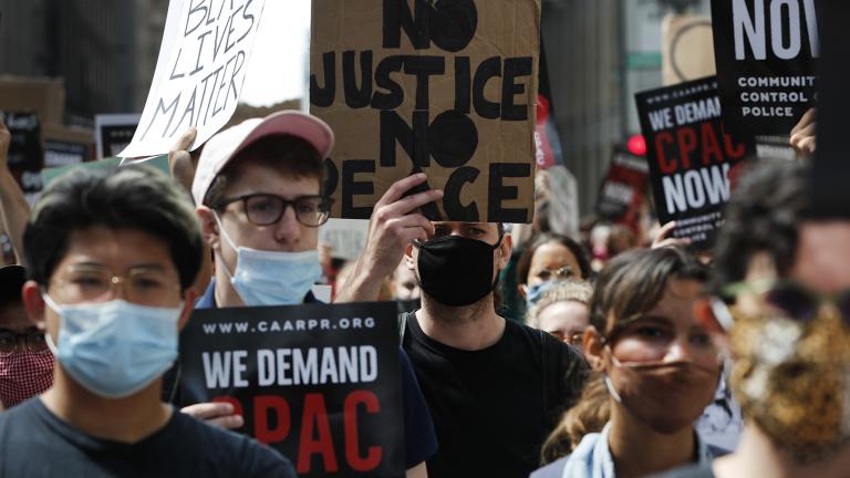 Protesters march around Chicago’s City Hall, Wednesday, June 17, 2020, demanding that Mayor Lori Lightfoot enact the ordinance for an all-elected Civilian Police Accountability Council, CPAC. (AP Photo / Charles Rex Arbogast)