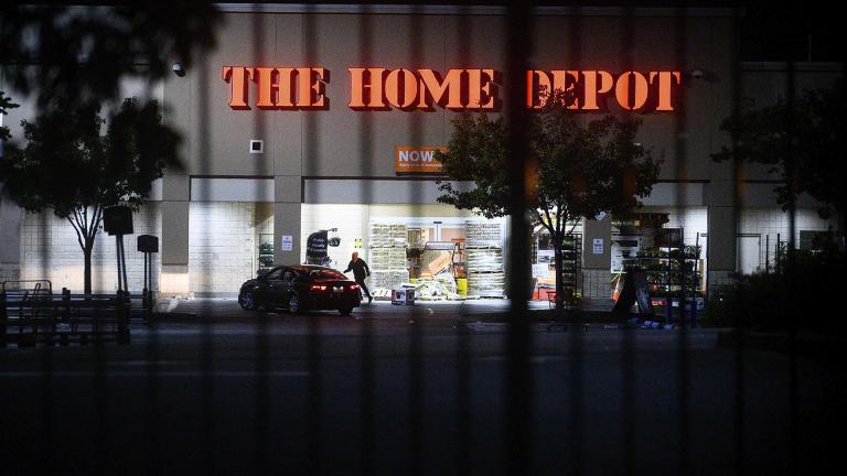 In this June 1, 2020, file photo, a man leaves a vandalized Home Depot store in Oakland, Calif.(AP Photo / Noah Berger, File)
