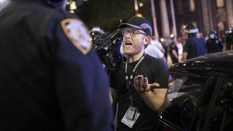 Associated Press videojournalist Robert Bumsted reminds a police officer that the press are considered “essential workers” and are allowed to be on the streets despite a curfew, Tuesday, June 2, 2020, in New York. (AP Photo / Wong Maye-E)