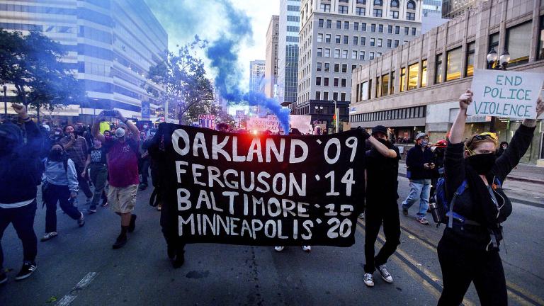 In this May 29, 2020, file photo, demonstrators march in Oakland, Calif. protesting the death of George Floyd, a handcuffed black man in police custody in Minneapolis. (AP Photo / Noah Berger, File
