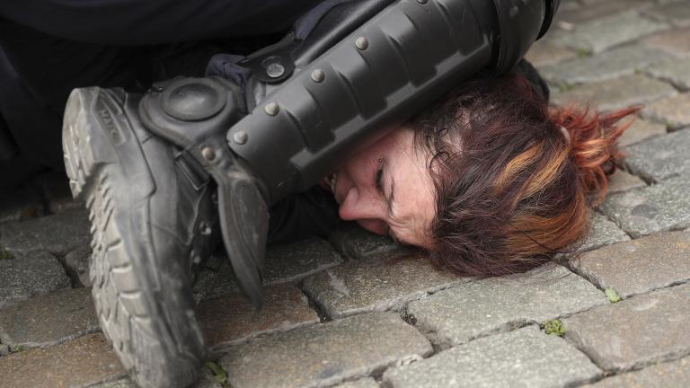 In this May 26, 2019, file photo, police detain a woman during a yellow vest protest with other groups in Brussels. The death of George Floyd has renewed scrutiny of immobilization techniques long used in policing around the world. (AP Photo / Francisco Seco, File)