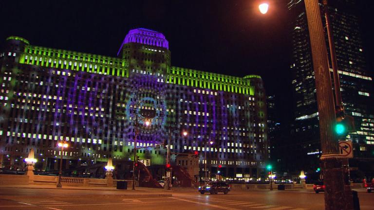 Art on the Mart’s unique location — projected across the massive face of the building formerly known as The Merchandise Mart, makes for optimal views whether you’re walking or driving. (WTTW News)
