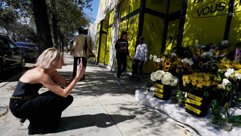 Flowers are left in memory of Virgil Abloh, Louis Vuitton's first Black artistic director, at a church in Miami's Design District, Tuesday, Nov. 30, 2021, in Miami. Abloh, a leading designer whose groundbreaking fusions of streetwear and high couture made him one of the most celebrated tastemakers in fashion and beyond, died of cancer. He was 41. (AP Photo / Marta Lavandier)