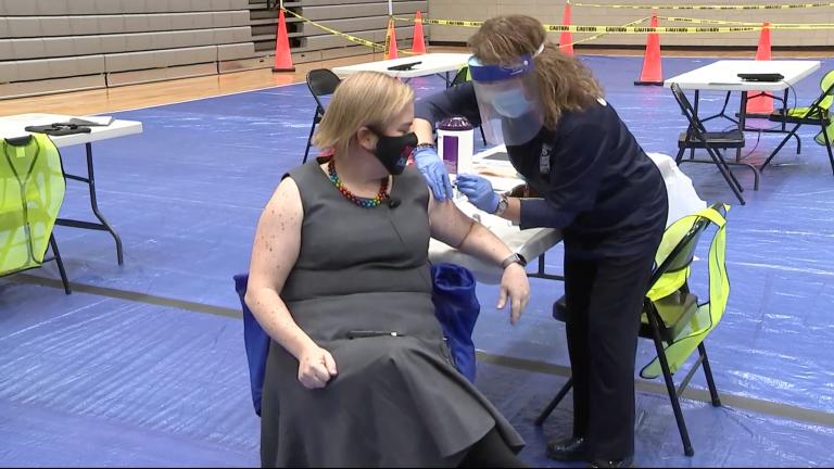 Chicago Department of Public Health Commissioner Dr. Allison Arwady receives the first dose of Pfizer’s COVID-19 vaccine at a new mass vaccination clinic on Tuesday, Dec. 29, 2020. (Chicago Mayor’s Office / Facebook)