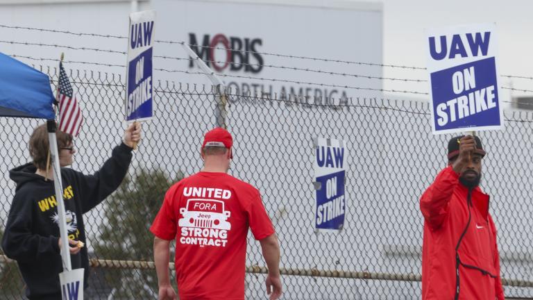 United Auto Workers union members strike for improved compensation outside of the Stellantis Toledo Assembly Complex on Thursday, Sept. 28, 2023 in Toledo, Ohio. (Phillip L. Kaplan /The Blade via AP)