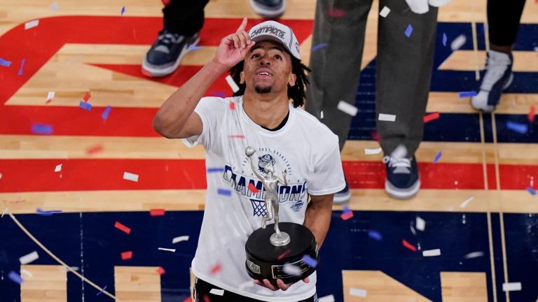Georgetown’s Dante Harris celebrates while holding the Most Outstanding Player trophy after an NCAA college basketball game against Creighton in the championship of the Big East Conference tournament Saturday, March 13, 2021, in New York. (AP Photo / Frank Franklin II)