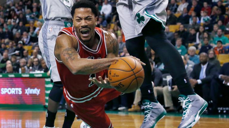 Chicago Bulls guard Derrick Rose falls after being tripped while driving against the Boston Celtics in the first half of an NBA basketball game in Boston, Nov. 28, 2014. (AP Photo / Elise Amendola, File)
