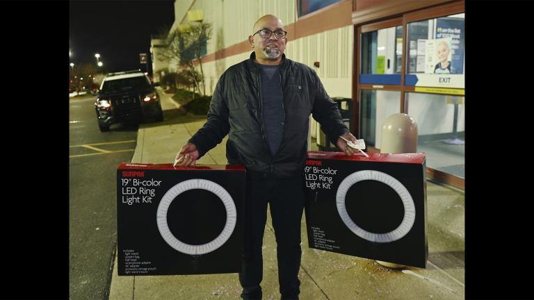 Daniel Ramon, 55, of Livonia, talks about his purchase of led lights for his daughters outside the Best Buy store in Novi, Mich., on Friday, Nov. 26, 2021. (Clarence Tabb, Jr. / Detroit News via AP) Daniel Ramon, 55, of Livonia, talks about his purchase of led lights for his daughters outside the Best Buy store in Novi, Mich., on Friday, Nov. 26, 2021. (Clarence Tabb, Jr. / Detroit News via AP)