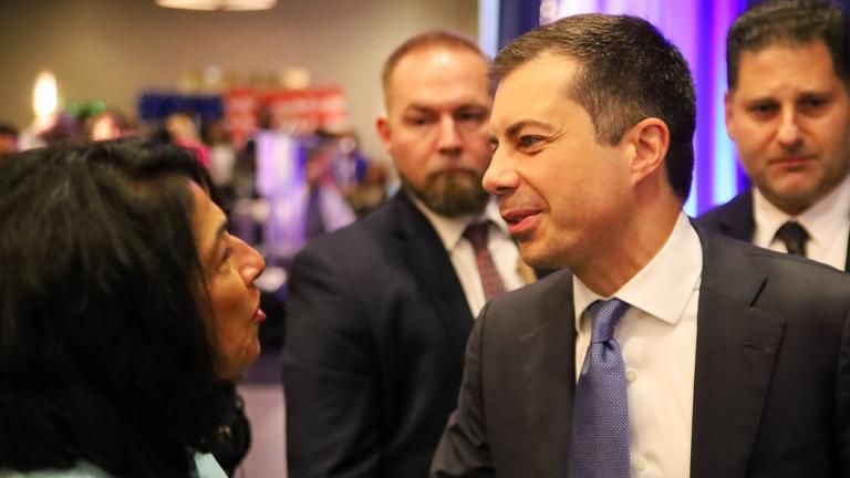 U.S. Transportation Secretary Pete Buttigieg talks to Democratic Party of Illinois Chair Lisa Hernandez during the Illinois delegation’s Wednesday breakfast, Aug. 21, 2024. (Andrew Adams / Capitol News Illinois)