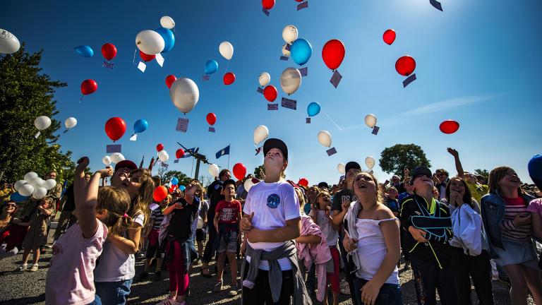 French children release balloons into the air during a D-Day remembrance ceremony at the United States Army Air Forces Transport Memorial in Picauville, France, June 1, 2017. (U.S. Air Force photo / Senior Airman Devin Boyer)
