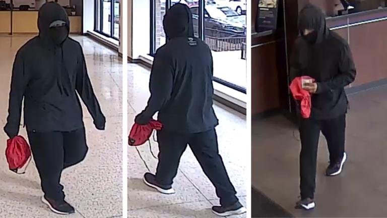 The FBI is offering a reward of up to $5,000 for information after a bank robber struck a pair of North Side branches just hours apart Monday.