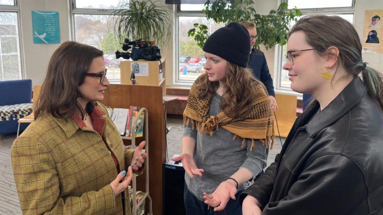 Bloomington Jefferson senior Shae Ross, center, joined Lieutenant Governor Peggy Flanagan, left, at an event promoting proposed legislation to prevent books bans based on ideology at Como Park High School in St. Paul, Minn., on March 21, 2024. (Chris Williams / Education Minnesota via AP)