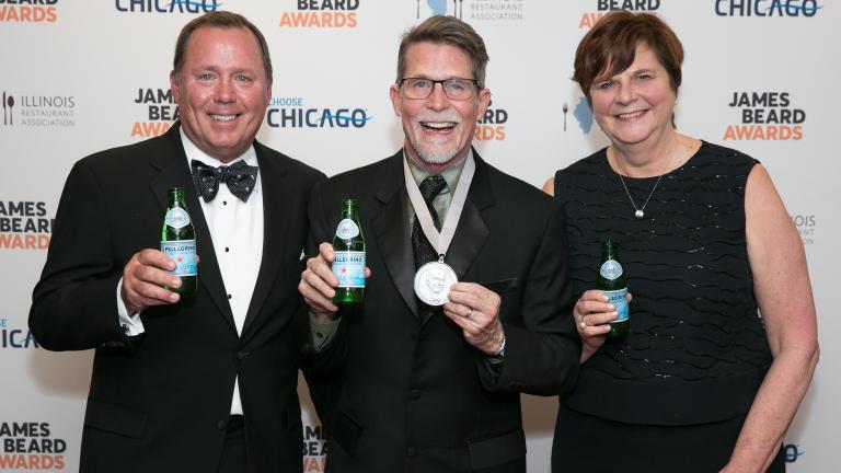 Rick Bayless, center, poses with his wife and business partner, Deann, and Dave Hardie, director of San Pellegrino. (Credit: Huge Galdones)