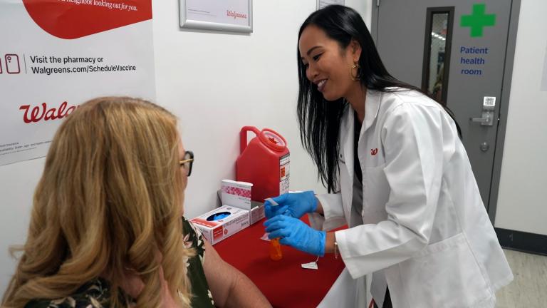 Anh Nguyen prepares to administer a COVID-19 vaccine for Kelly Vazquez at a pharmacy in New York, Tuesday, Sept. 24, 2024. (AP Photo / Mary Conlon)