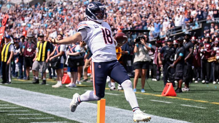 Chicago Bears quarterback Caleb Williams (18) runs to score a touchdown during the first half of an NFL football game, Sunday, Sept. 13, 2026, in Charlotte, N.C. (AP Photo / Scott Kinser)