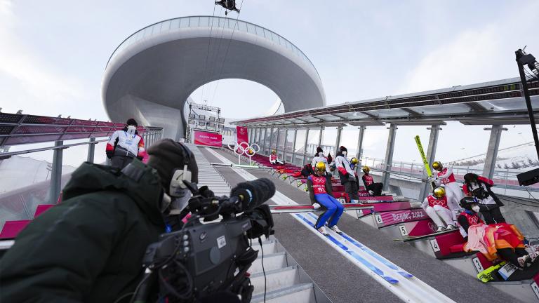 Timi Zajc, of Slovenia, prepares to jump during a men's normal hill ski jumping training session at the 2022 Winter Olympics, Friday, Feb. 4, 2022, in Zhangjiakou, China. (AP Photo / Matthias Schrader)