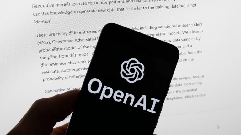 The OpenAI logo is seen on a mobile phone in front of a computer screen displaying output from ChatGPT, March 21, 2023, in Boston. (AP Photo / Michael Dwyer, File)