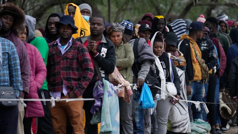 Haitian migrants who hope to apply for asylum in the U.S. wait to register their names on a list made by a religious organization in Reynosa, Mexico, Dec. 21, 2022, on the other side of the border with McAllen, Texas. (AP Photo / Fernando Llano, File)