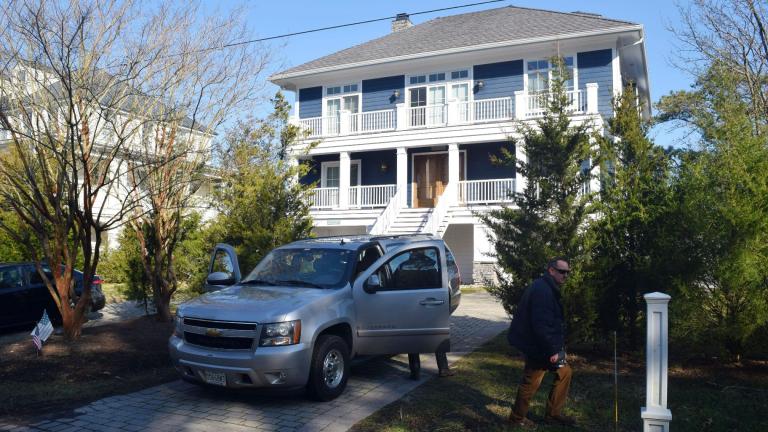 U.S. Secret Service agents are seen in front of Joe Biden's Rehoboth Beach, Del., home on Jan. 12, 2021(Shannon McNaught / Delaware News Journal via AP, File)