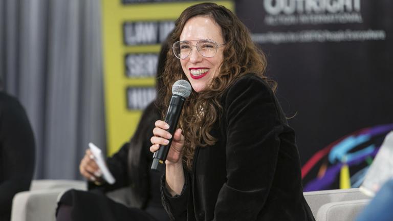 In this Dec. 7, 2019 photo provided by Brad Hamilton, Jessica Stern, head of Outright International, speaks during the OutSummit in New York. (Brad Hamilton / OutRight Action International via AP)