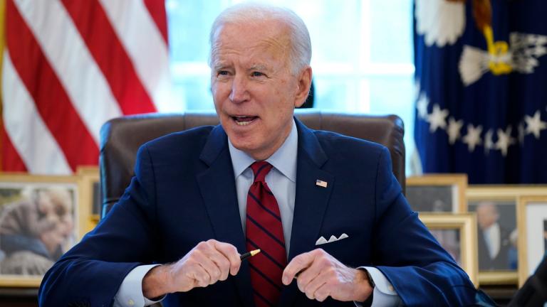 In this Jan. 28, 2021 file photo, President Joe Biden signs a series of executive orders in the Oval Office of the White House in Washington. (AP Photo / Evan Vucci) In this Jan. 28, 2021 file photo, President Joe Biden signs a series of executive orders in the Oval Office of the White House in Washington. (AP Photo / Evan Vucci)