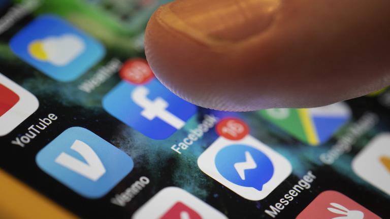 This Aug. 11, 2019, file photo an iPhone displays the apps for Facebook and Messenger in New Orleans. (AP Photo / Jenny Kane, File)
