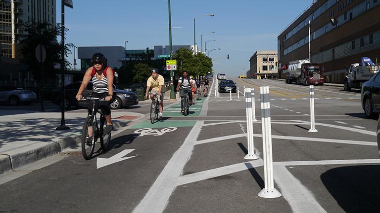Chicago's first protected bike lane was installed on Kinzie Street in June 2011. On Monday, the city announced plans to design new bike lanes and improve existing ones. (Chicago Bicycle Program / Flickr)