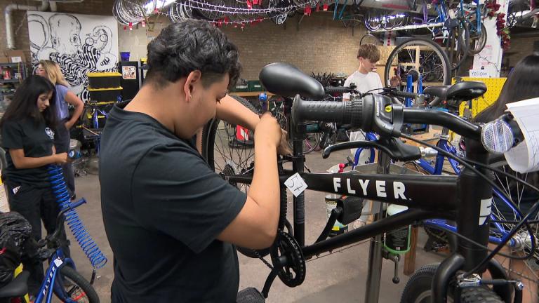 Bikes N’ Roses is one of several free programs offered through Communities United’s Workbench Project, which introduces young people ages 13 to 18 to trades. (WTTW News)